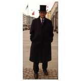 man with tophat and coat