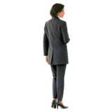 woman in trouser suit, standing