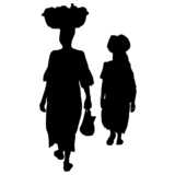 Two African women with shopping baskets on their head. Silhouette.