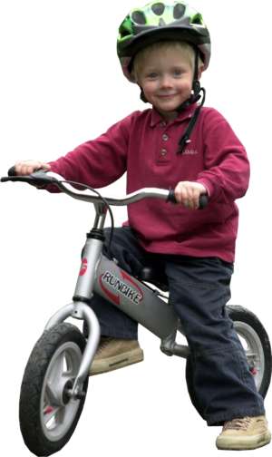 child with trainer bike