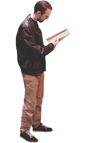 Young man reading while standing