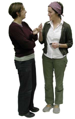 2 women, standing, chatting
